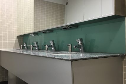 Integrated paper towel dispenser