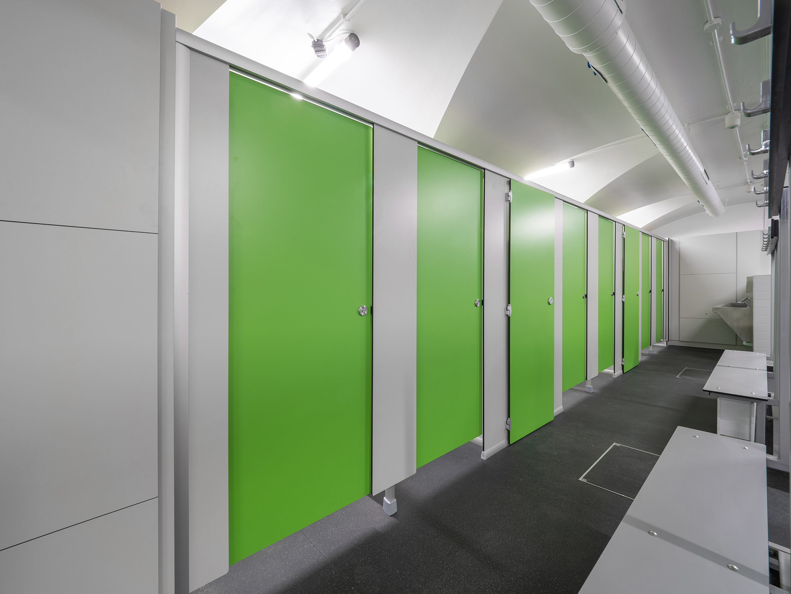 Thor toilet cubicles with bespoke door height for cleaning cupboard