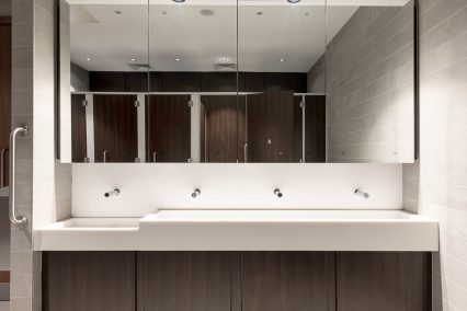 Solid surface vanity with matching under basin paneling